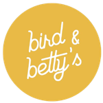 Yellow circle with 'bird & betty's' in white script.